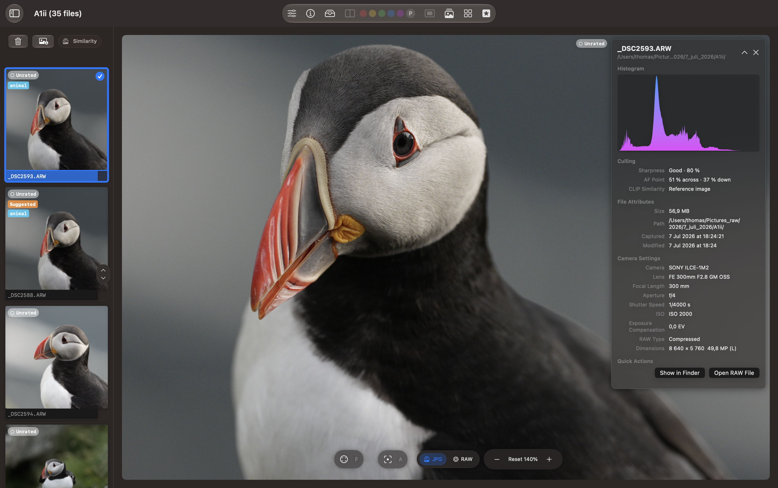 Loupe view showing a puffin photo, nearby frames, and the photo information panel